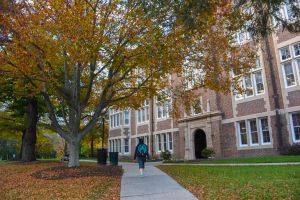 a student walking towards the side entrance of Stephens Hall