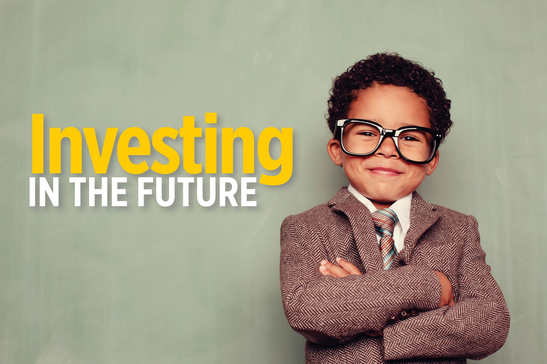 Investing in the Future: a young child in a suit with his arms crossed looking confident and smiling