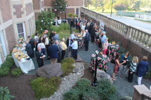 Guests mingling in the scene sunken gardens at Stephens Hall