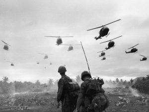 Huey BH-1 helicopters land in a barren field in South Vietnam, 1967