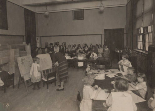 Student teachers, seated at the far end, observing a class at the campus elementary school. Student teachers could both observe, as well as get practical teaching experience in a real school setting 