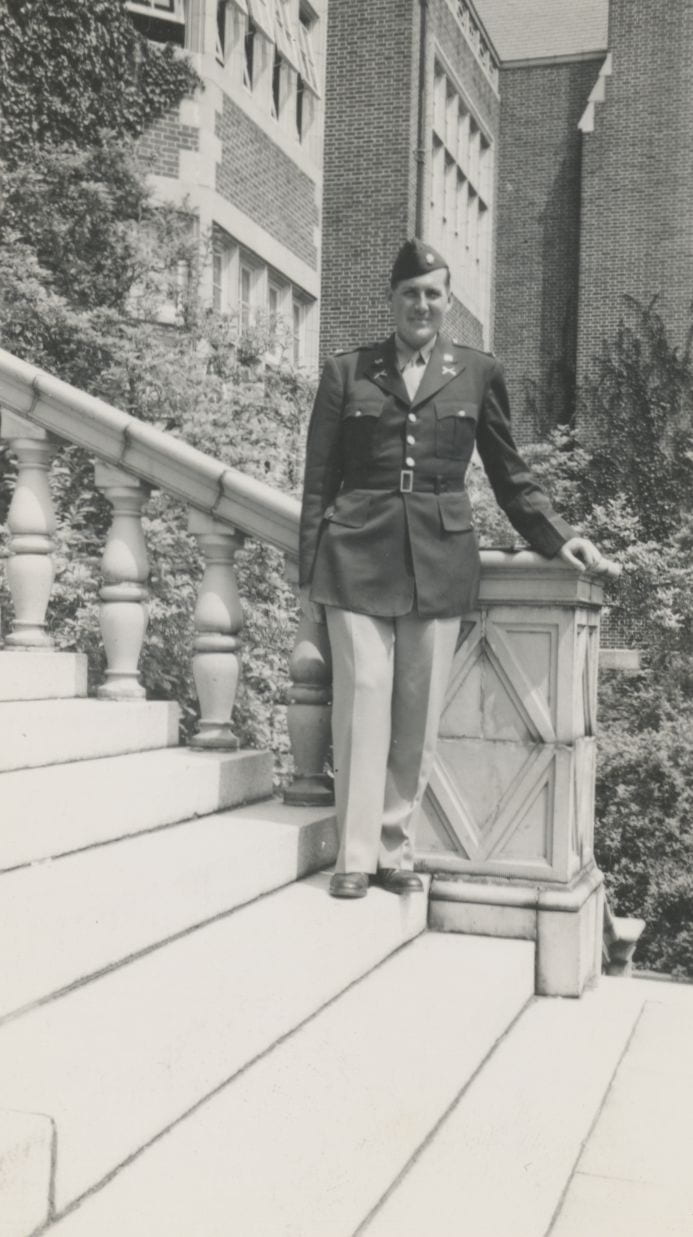Photo of Norris in dress uniform standing on steps of Stephens Hall.